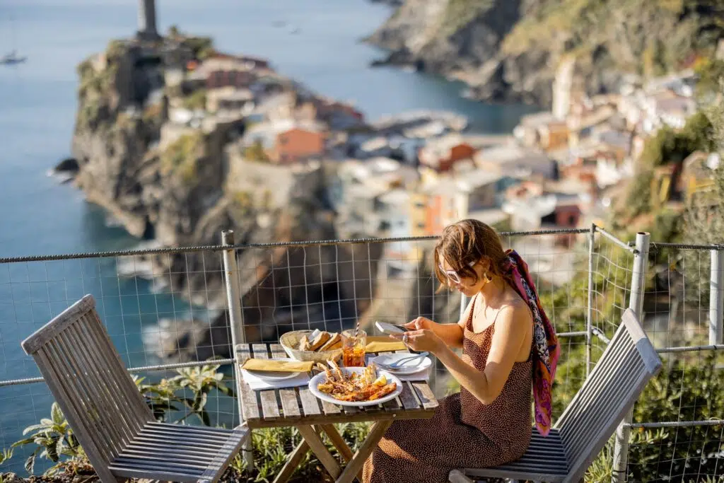 Woman traveling famous Cinque Terre towns in northwestern Italy